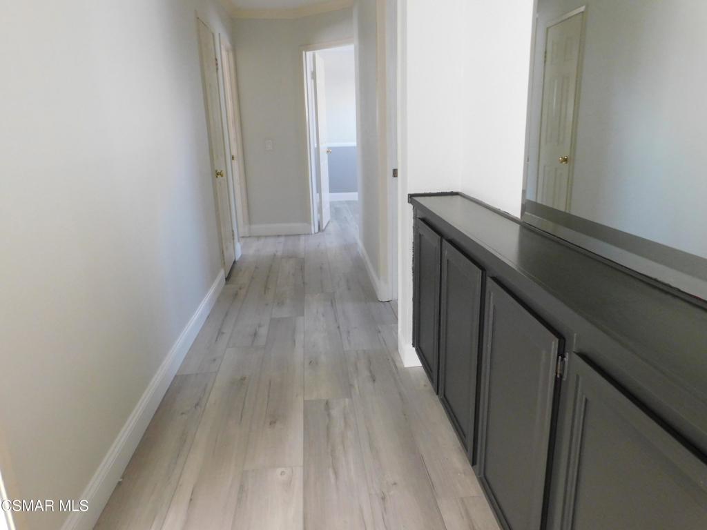 559 Stoney Peak Court Simi Valley, CA 93065 - Photo 25 of 62 a view of hallway with wooden floor