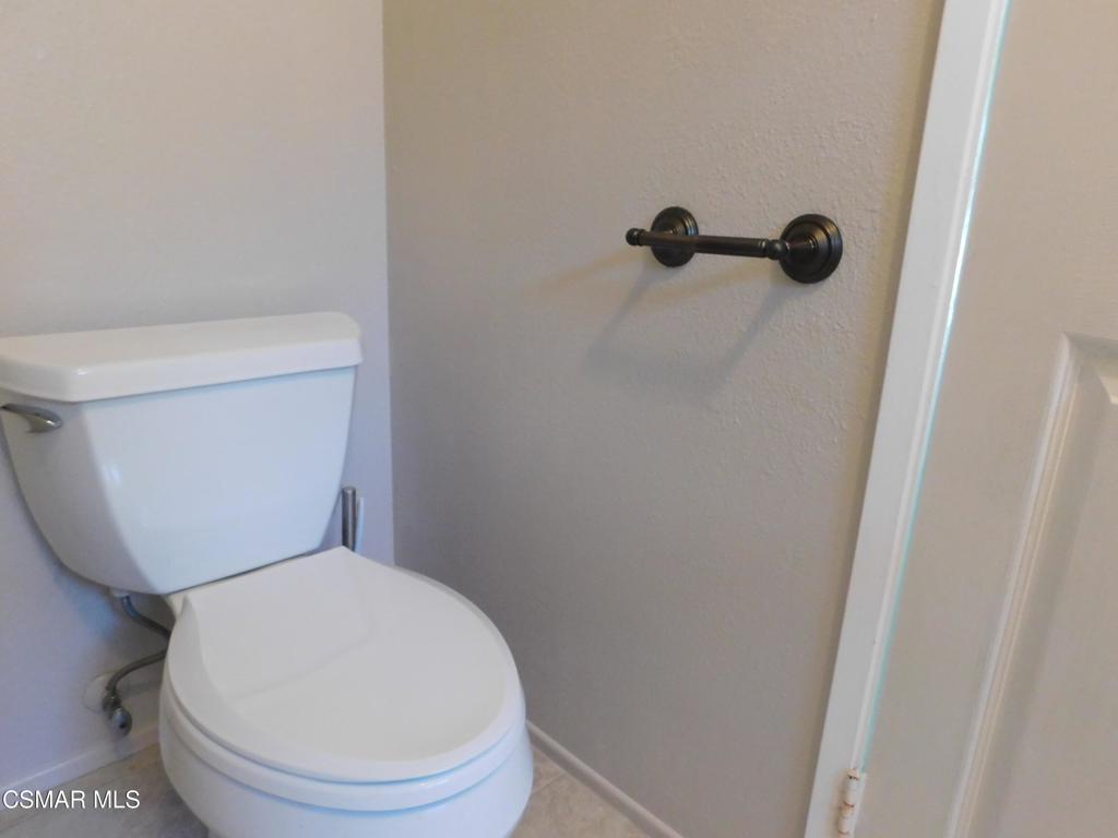 559 Stoney Peak Court Simi Valley, CA 93065 - Photo 35 of 62 a white toilet sitting next to a shower