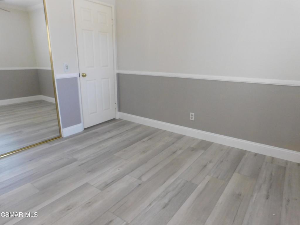 559 Stoney Peak Court Simi Valley, CA 93065 - Photo 38 of 62 an empty room with wooden floor