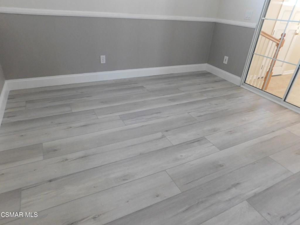 559 Stoney Peak Court Simi Valley, CA 93065 - Photo 40 of 62 a view of empty room with window and wooden floor