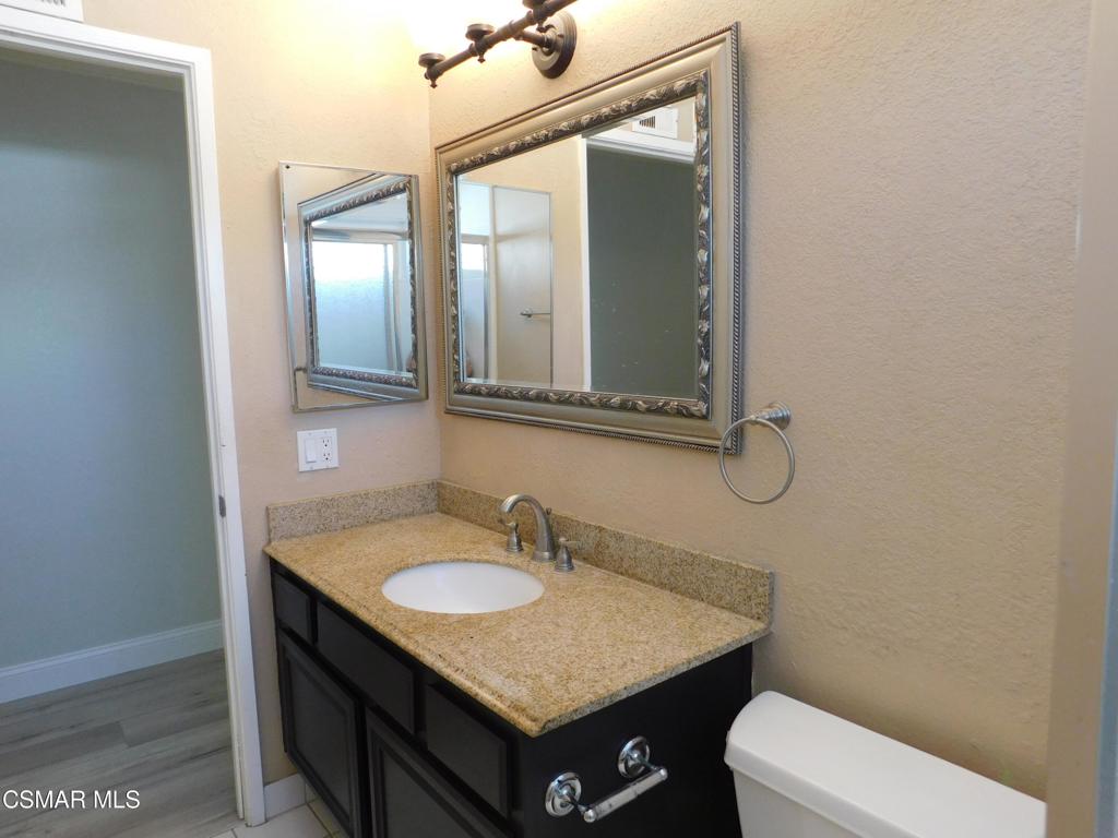 559 Stoney Peak Court Simi Valley, CA 93065 - Photo 43 of 62 a bathroom with a sink vanity and toilet