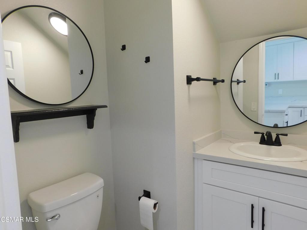 559 Stoney Peak Court Simi Valley, CA 93065 - Photo 45 of 62 a bathroom with a sink mirror and toilet