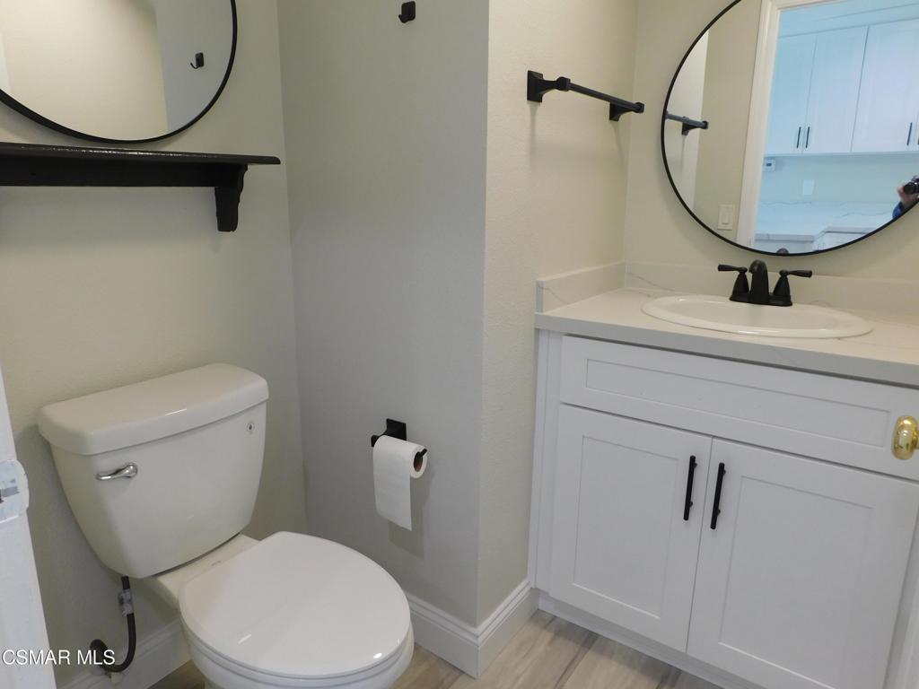 559 Stoney Peak Court Simi Valley, CA 93065 - Photo 46 of 62 a bathroom with a sink mirror vanity and toilet