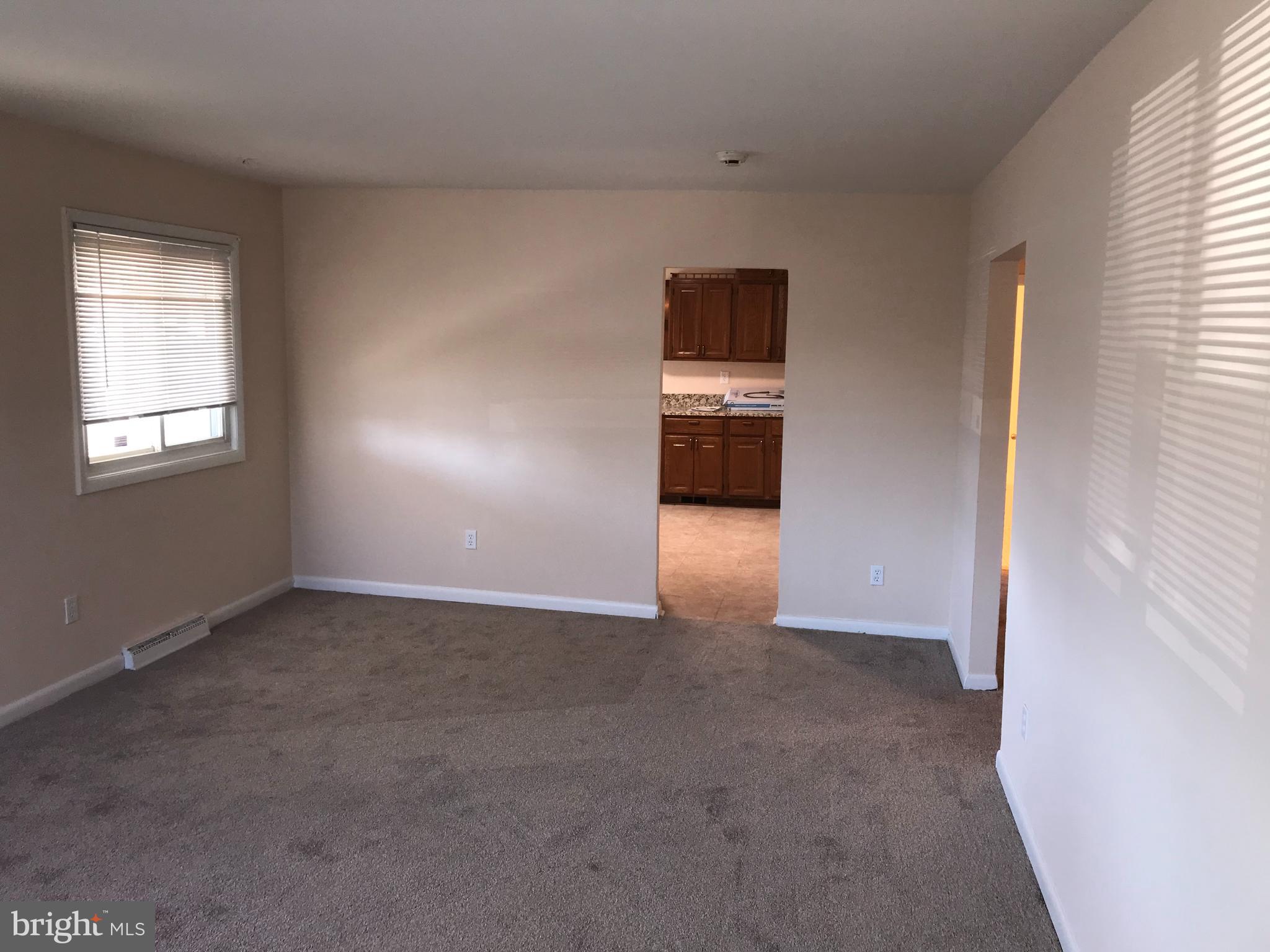 6200 Auth Road Suitland, MD 20746 - Photo 10 of 49 Living room to kitchen