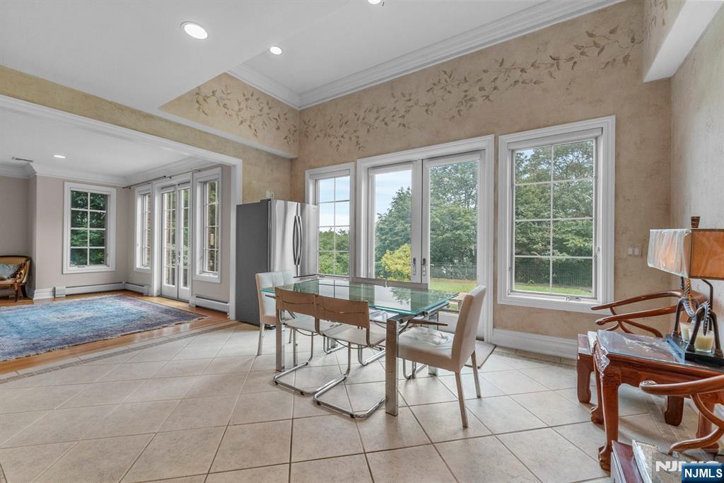 1 Euclid Road Fort Lee, NJ 07024 - Photo 14 of 50 a living room with furniture and large windows
