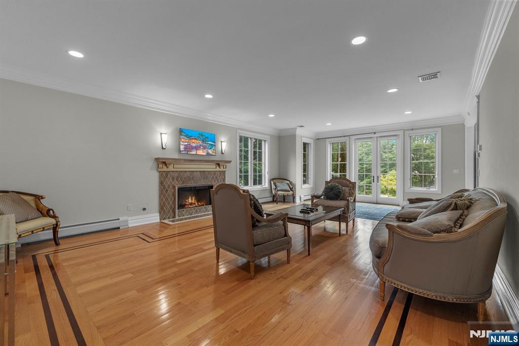 1 Euclid Road Fort Lee, NJ 07024 - Photo 19 of 50 a living room with furniture and a fireplace
