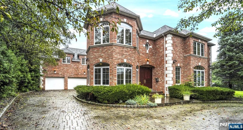 1 Euclid Road Fort Lee, NJ 07024 - Photo 2 of 50 a front view of a house with a yard