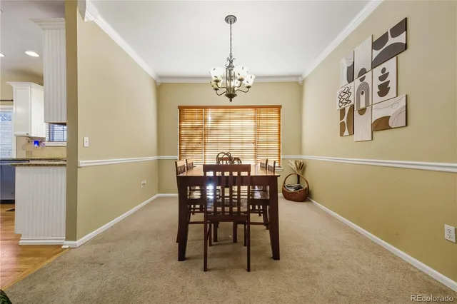 a view of a dining room with furniture and window