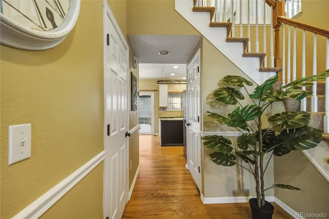 a view of a hallway with paintings on the wall