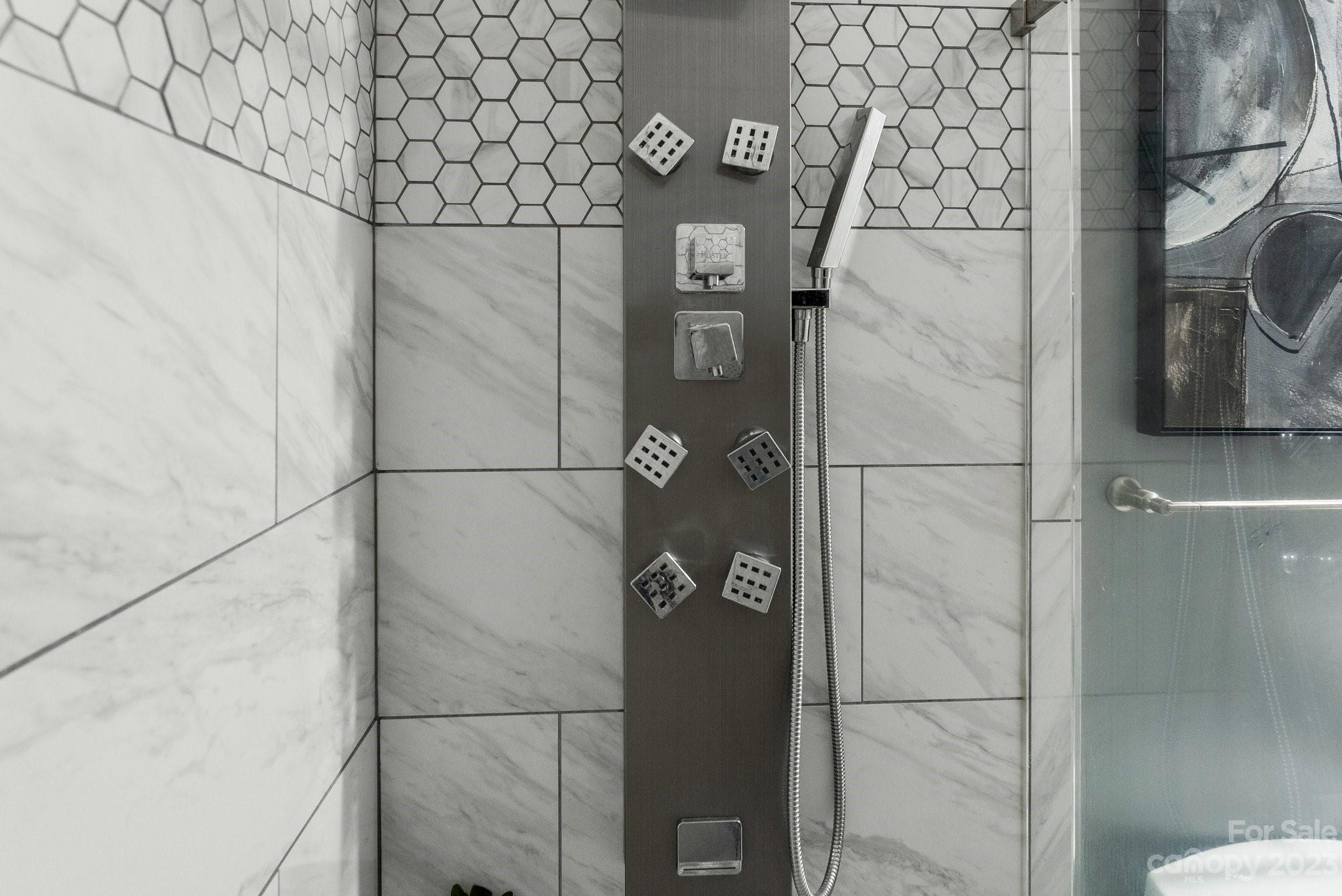 19905 Henderson Road, Unit A Cornelius, NC 28031 - Photo 15 of 46 a bathroom with a shower and a mirror