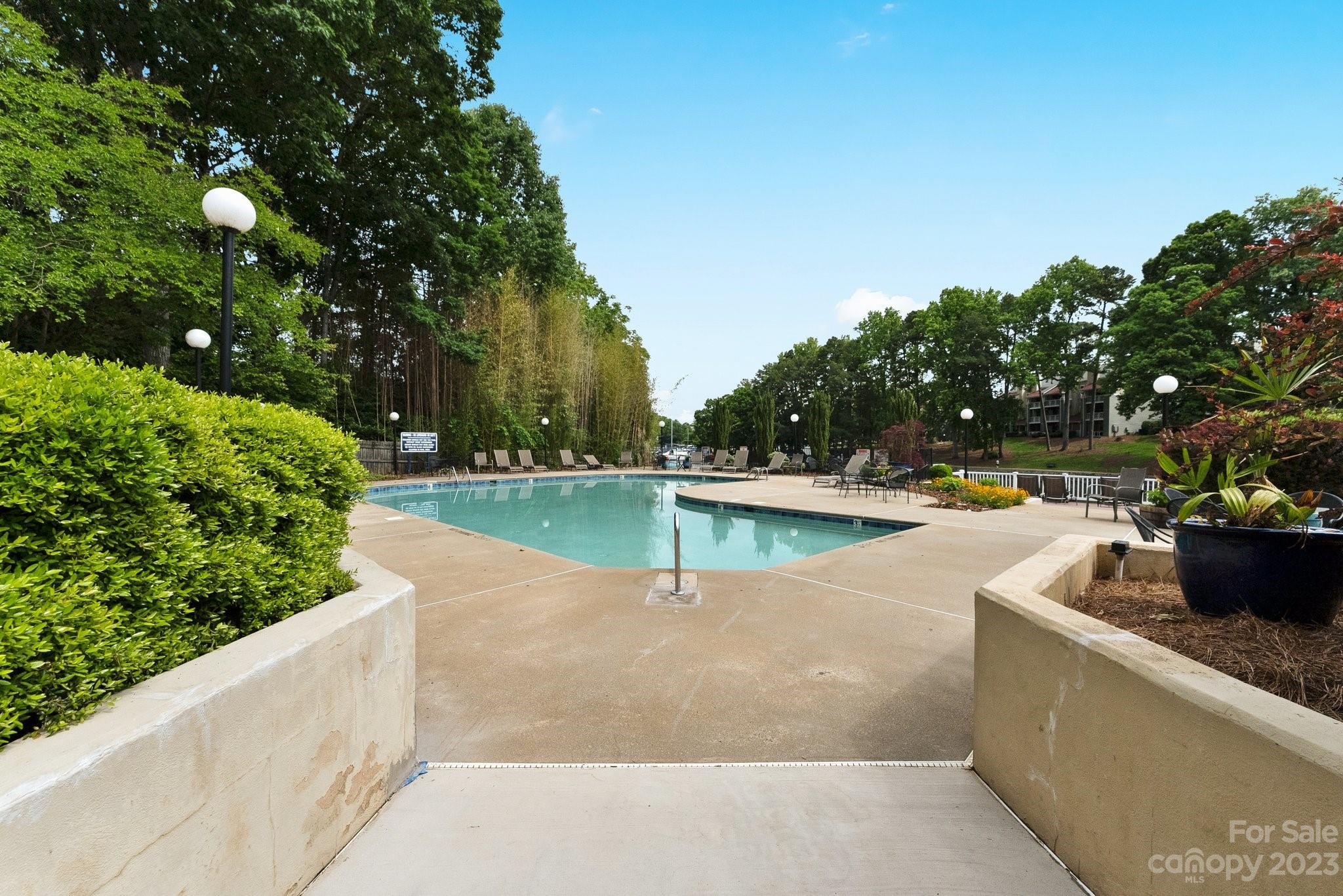 19905 Henderson Road, Unit A Cornelius, NC 28031 - Photo 34 of 46 a view of swimming pool with a garden