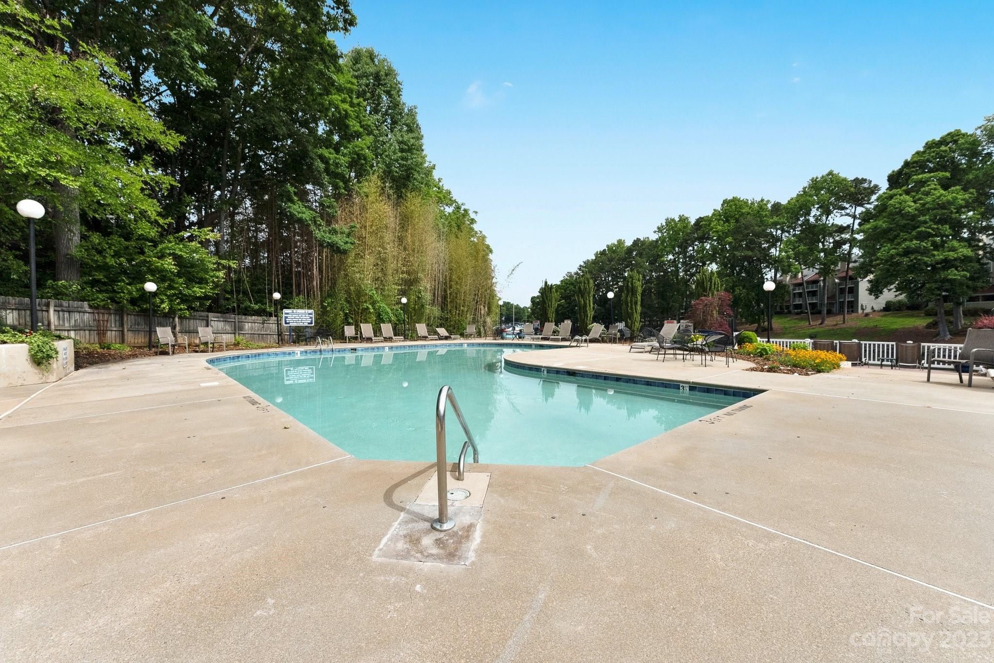 19905 Henderson Road, Unit A Cornelius, NC 28031 - Photo 35 of 46 a view of a swimming pool with a patio