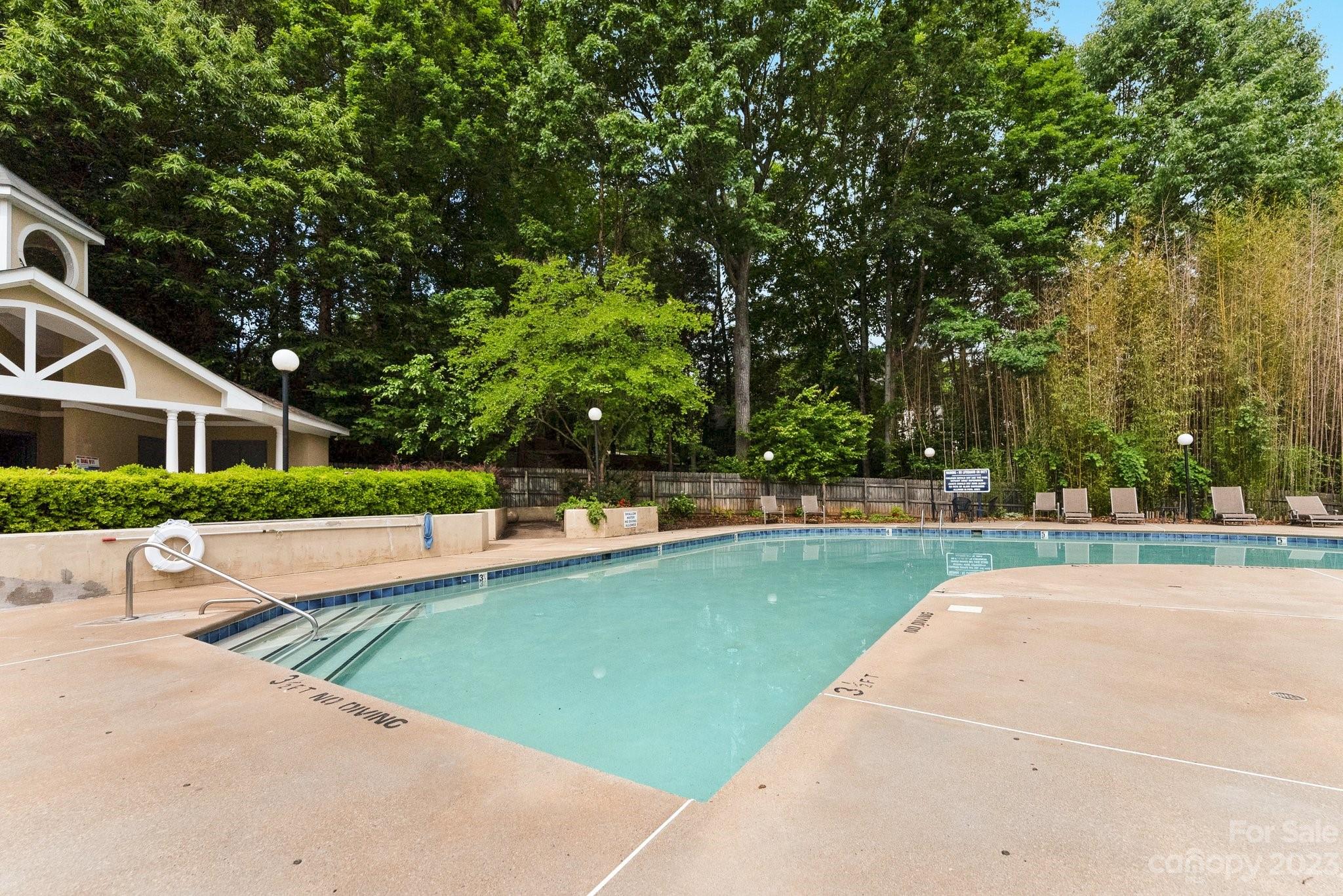 19905 Henderson Road, Unit A Cornelius, NC 28031 - Photo 37 of 46 a view of a house with swimming pool