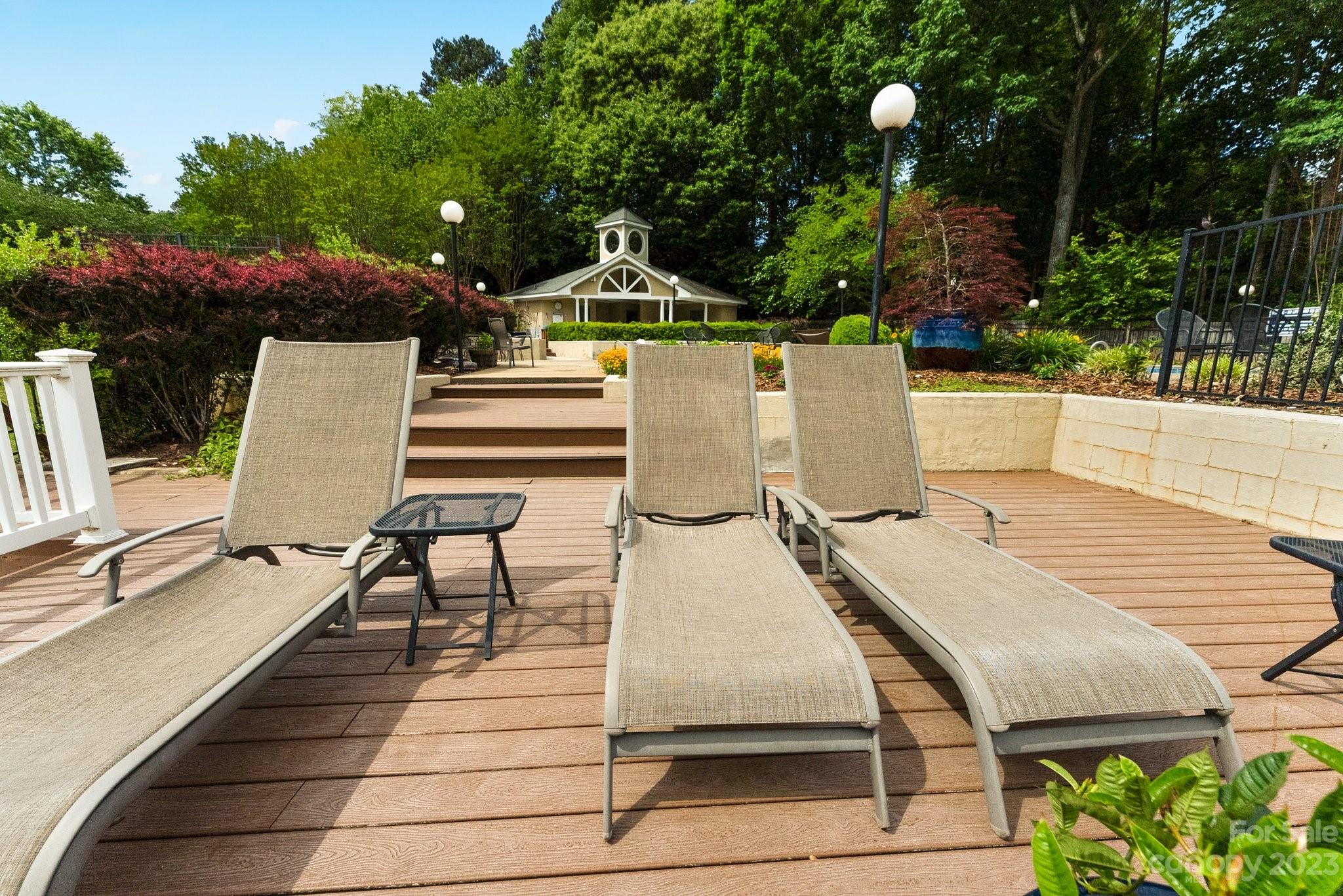 19905 Henderson Road, Unit A Cornelius, NC 28031 - Photo 38 of 46 a view of a patio with chairs and a table