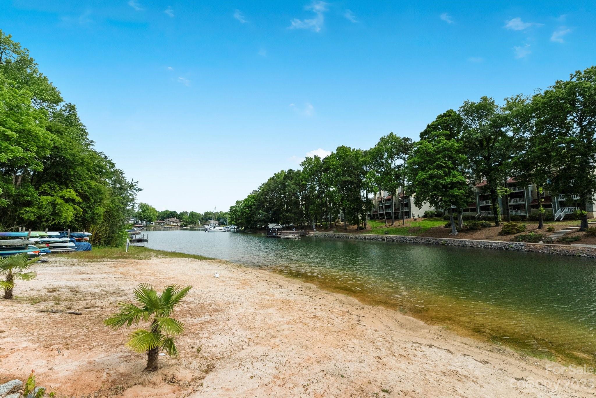 19905 Henderson Road, Unit A Cornelius, NC 28031 - Photo 40 of 46 a view of a lake with houses in the back