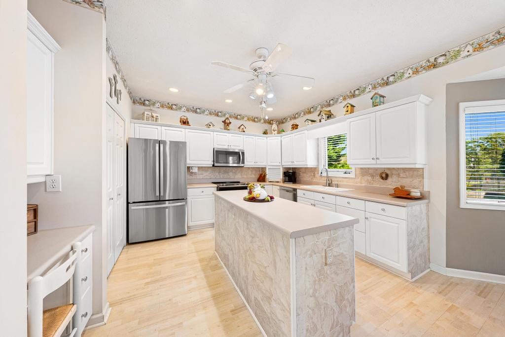 109 Sheldon Lane Westminster, SC 29693 - Photo 12 of 39 This spacious kitchen offers ample storage, bright finishes, and a functional island, perfect for daily living.