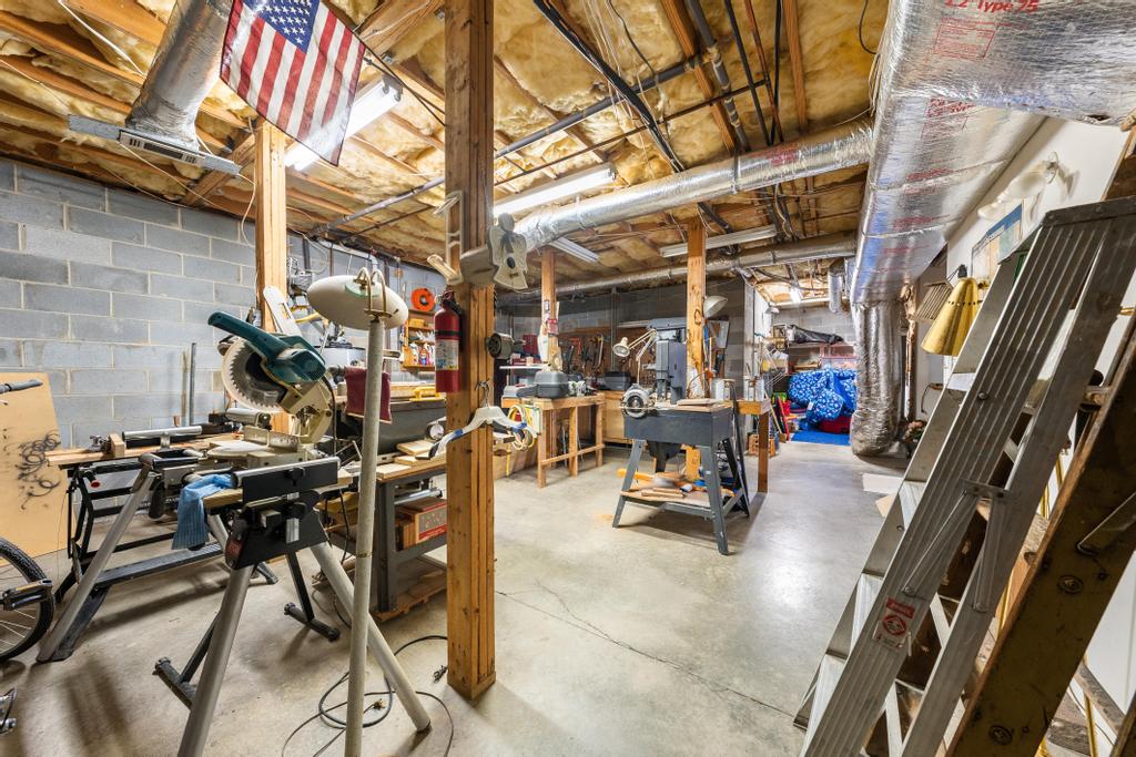 109 Sheldon Lane Westminster, SC 29693 - Photo 25 of 39 This spacious workshop offers ample room for creative projects and storage.