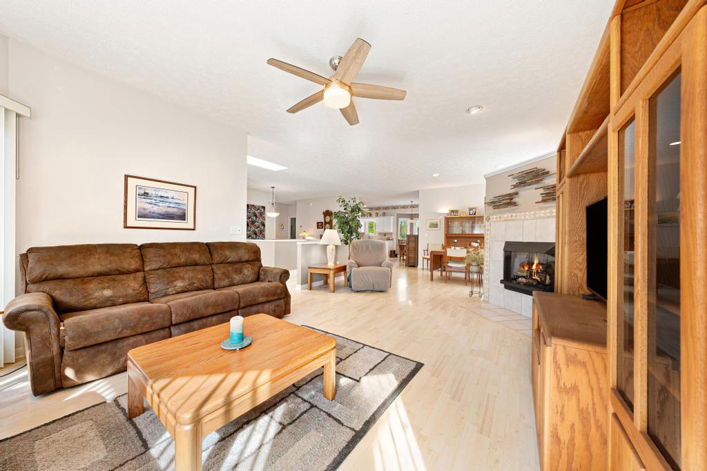 109 Sheldon Lane Westminster, SC 29693 - Photo 9 of 39 This bright living space features hardwood flooring and a cozy fireplace, perfect for gatherings.