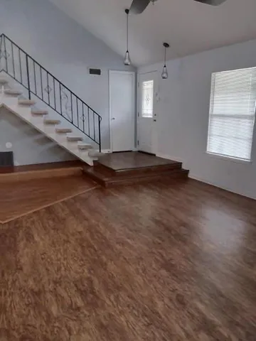 a view of an entryway with wooden floor
