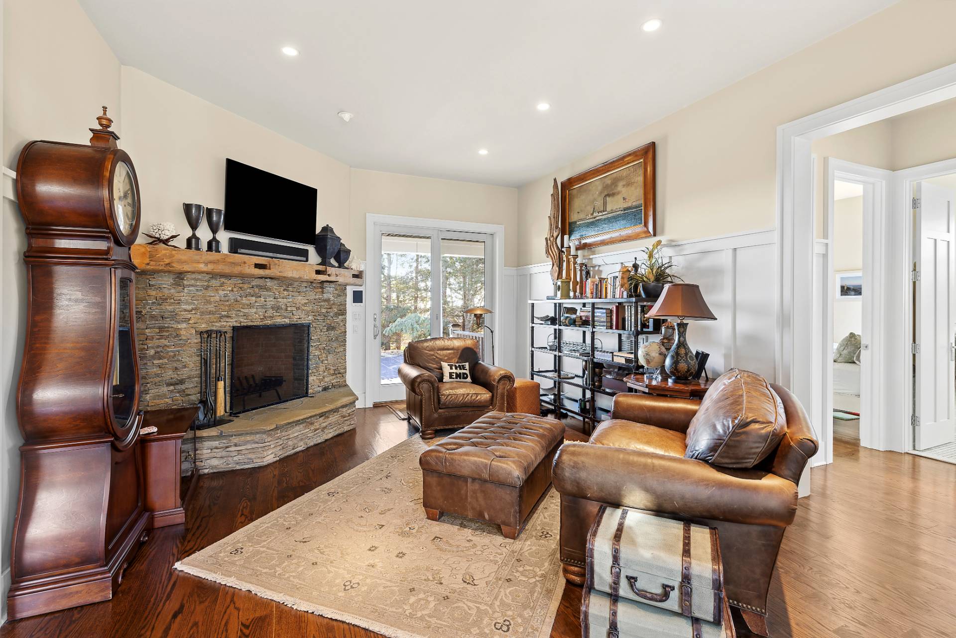 23 Sycamore Lane Montauk, NY 11954 - Photo 13 of 33 a living room with furniture a flat screen tv and a fireplace