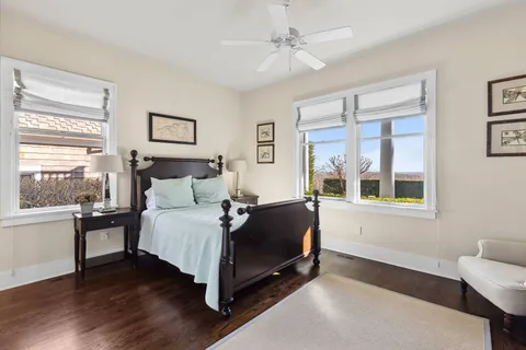 a living room with stainless steel appliances furniture and a window