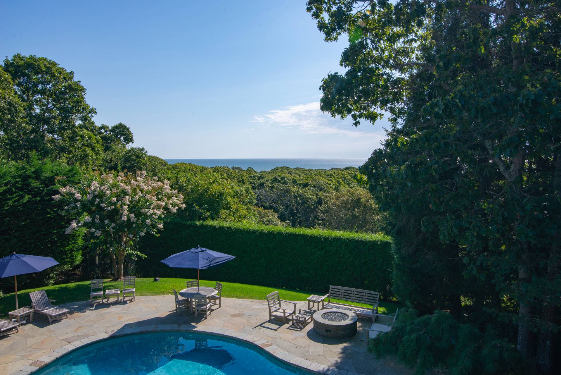 23 Sycamore Lane Montauk, NY 11954 - Photo 28 of 33 a view of a table and chairs in patio