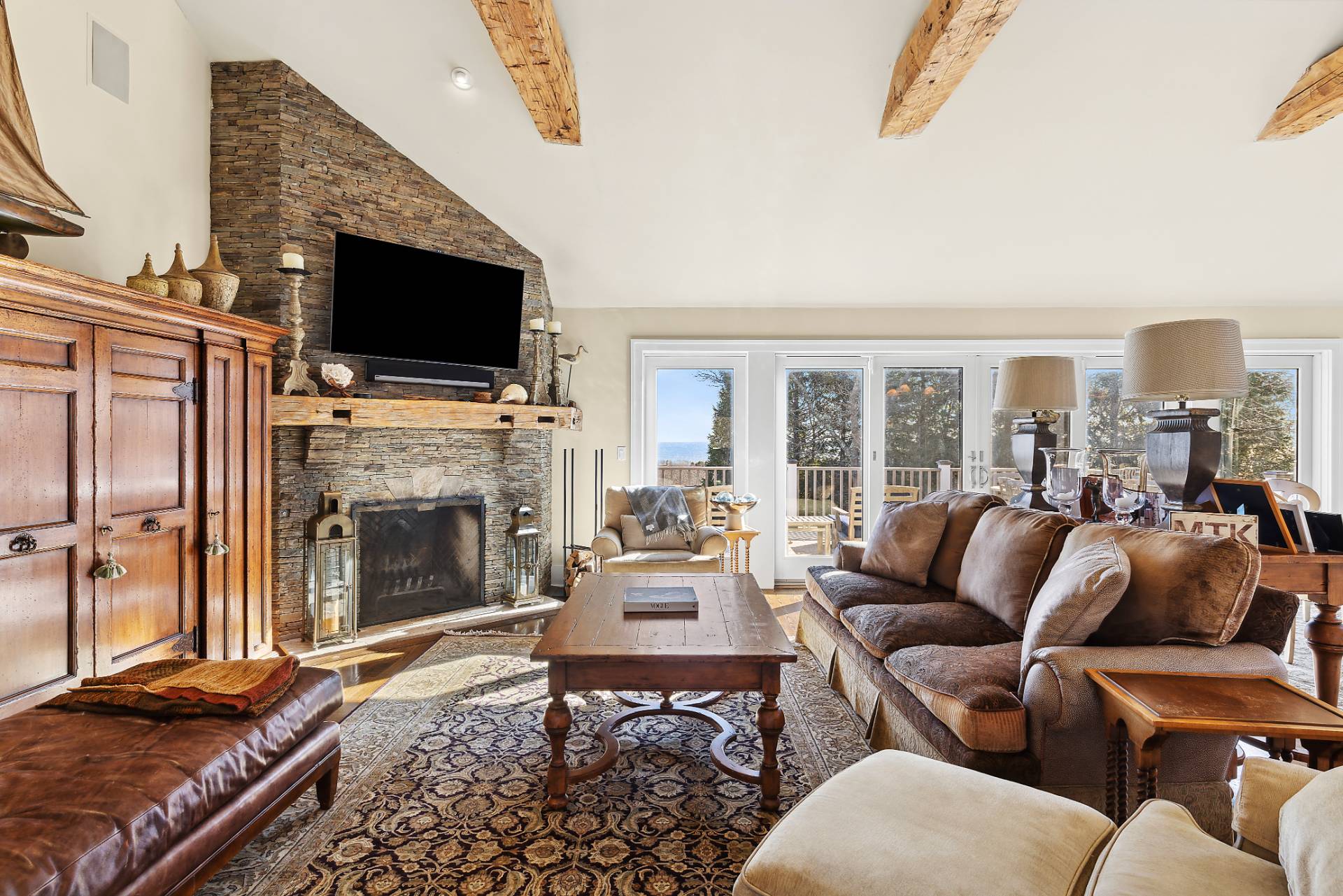 23 Sycamore Lane Montauk, NY 11954 - Photo 6 of 33 a living room with furniture fireplace and flat screen tv