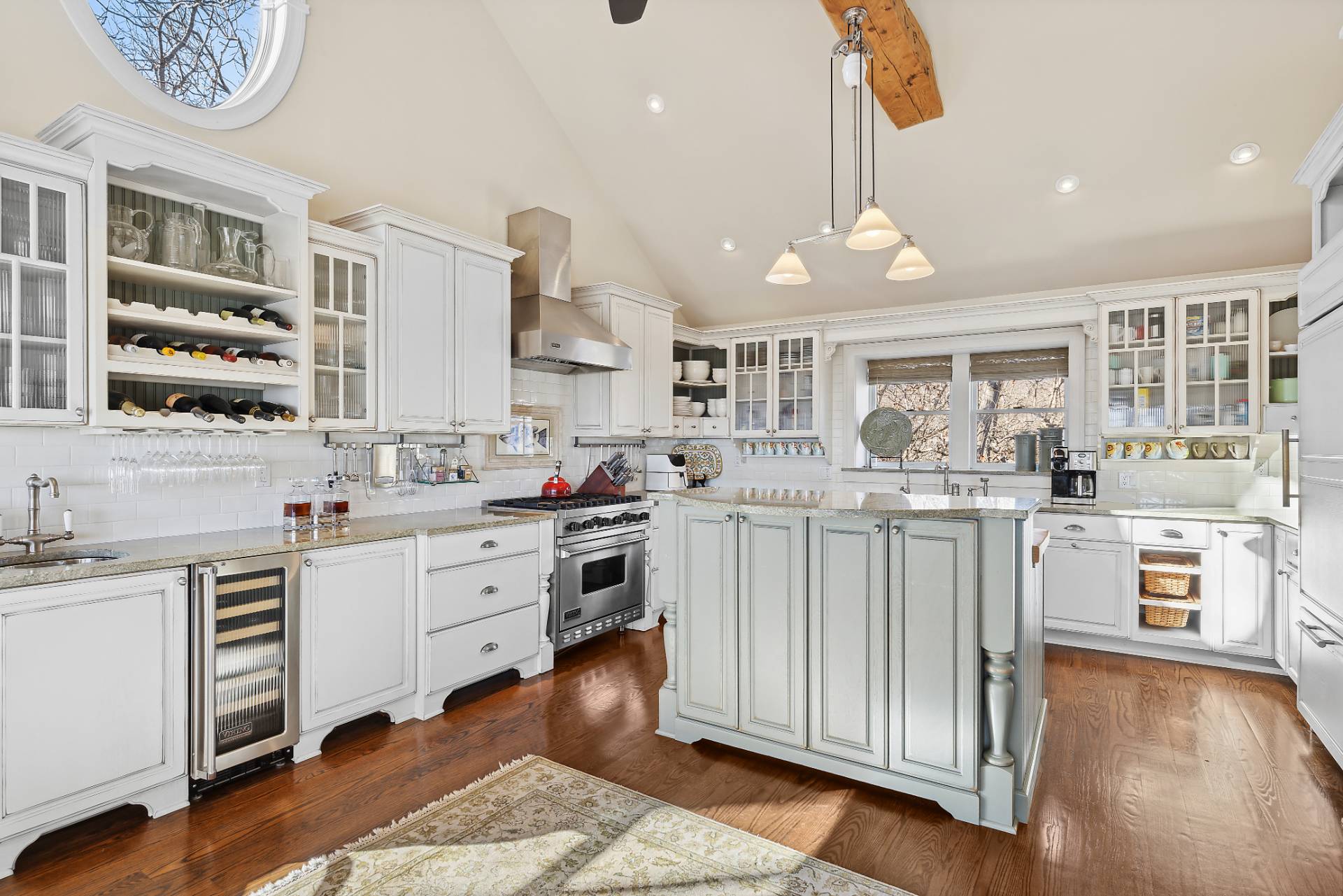 23 Sycamore Lane Montauk, NY 11954 - Photo 9 of 33 a kitchen with white cabinets and appliances