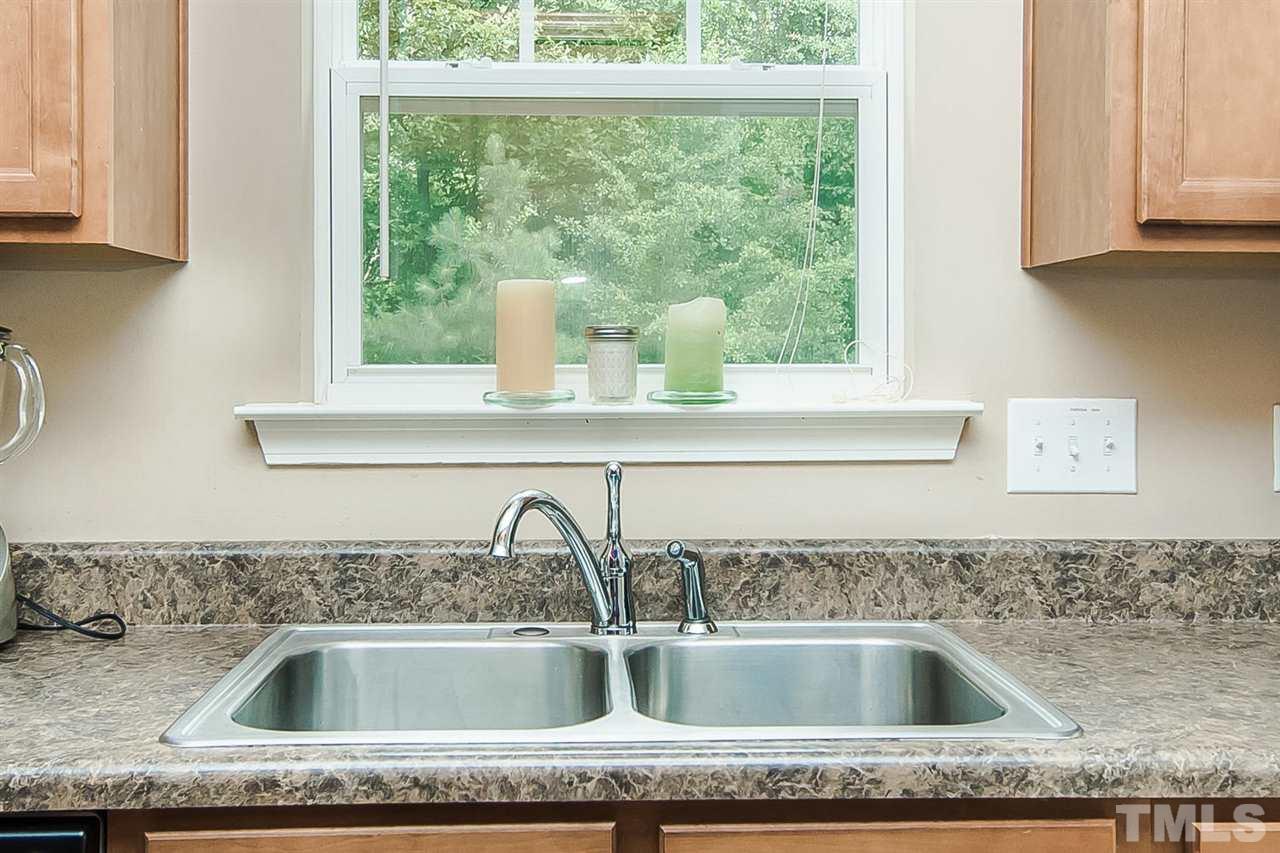616 Smith Ridge Way Fuquay-Varina, NC 27526 - Photo 14 of 21 Opposite side of kitchen, you can check on everybody in the backyard while you wash the dishes!