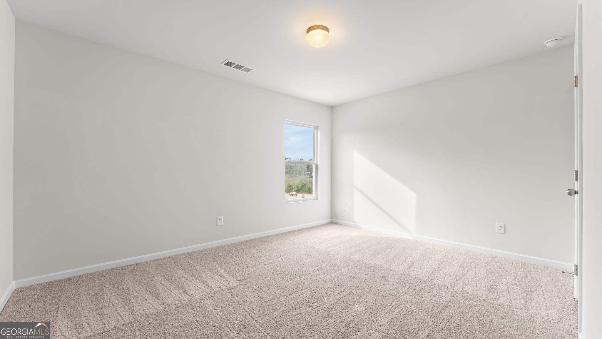 44 Umber Lane Newnan, GA 30263 - Photo 16 of 28 a view of an empty room with a window