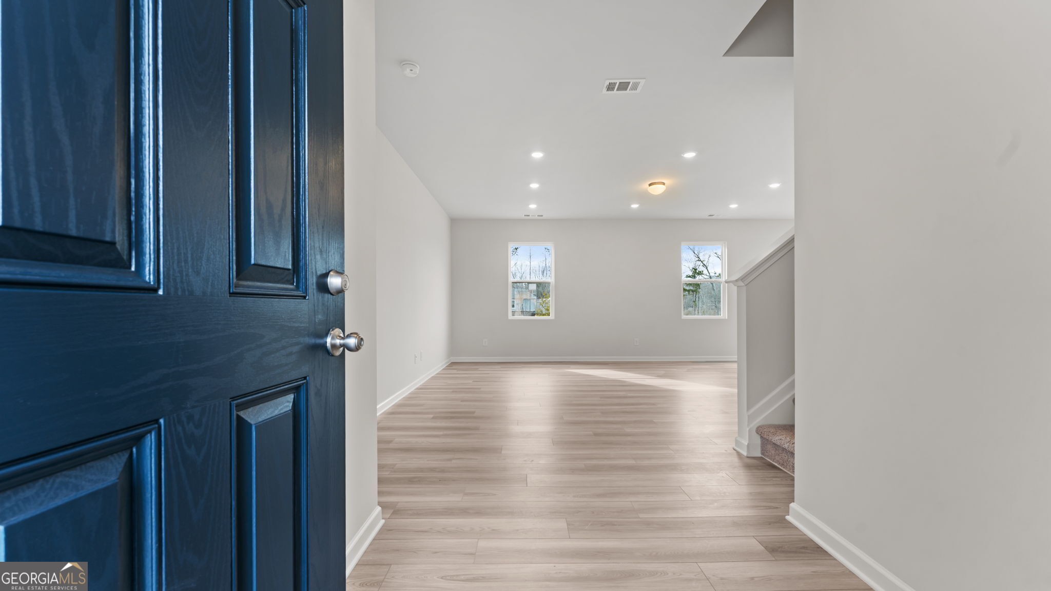 44 Umber Lane Newnan, GA 30263 - Photo 4 of 28 a view of an empty room with window and wooden floor