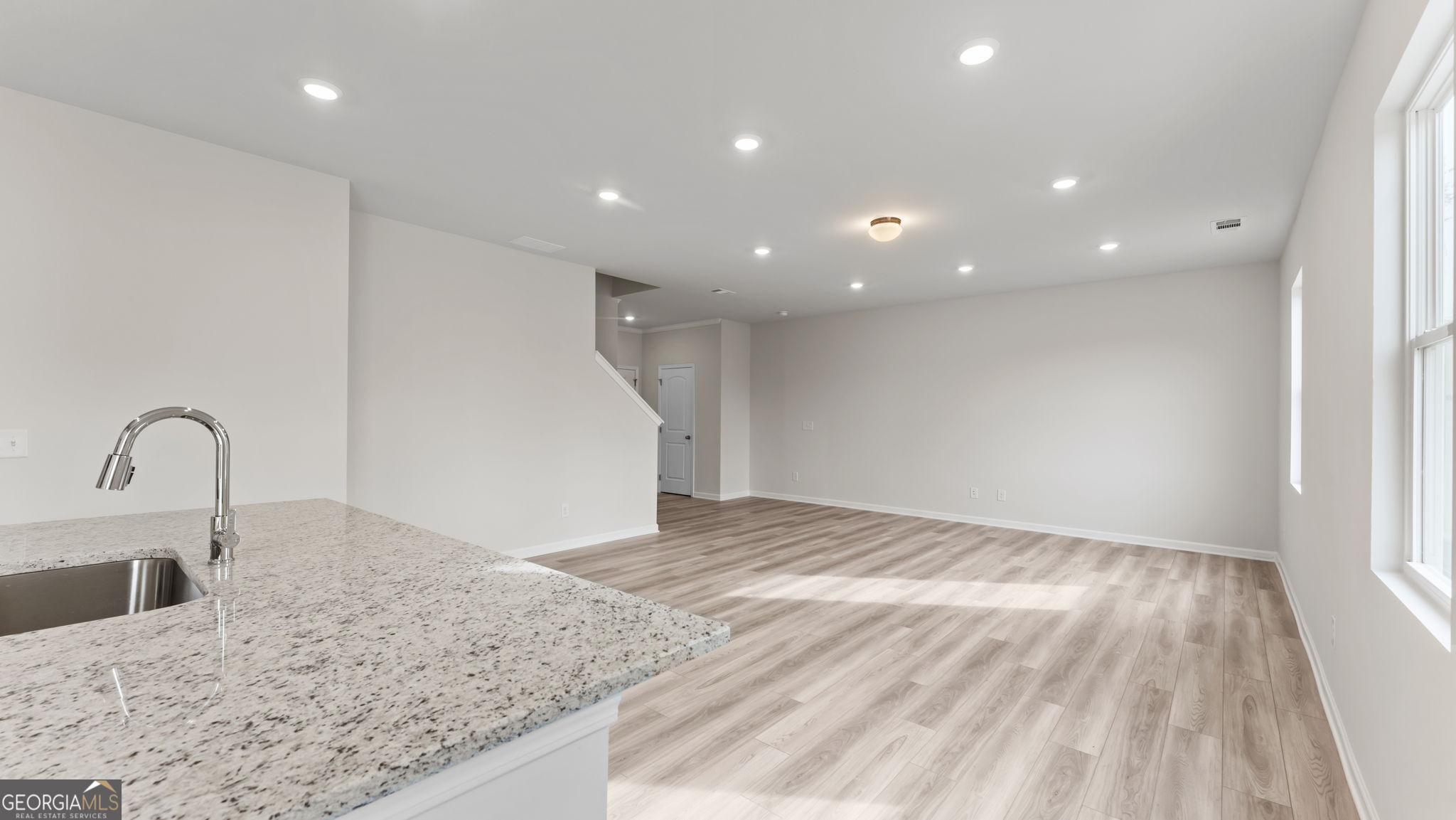 44 Umber Lane Newnan, GA 30263 - Photo 8 of 28 a view of a kitchen with a sink and cabinets