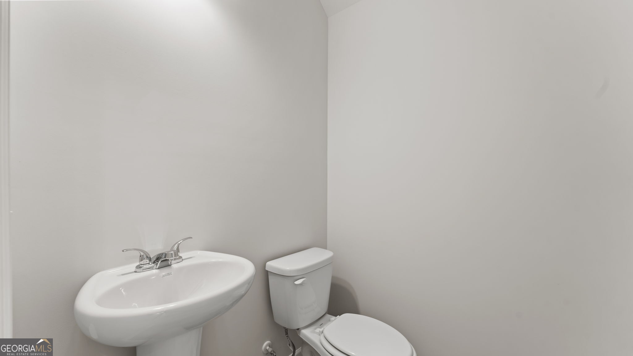 44 Umber Lane Newnan, GA 30263 - Photo 9 of 28 a white toilet sitting next to a white sink