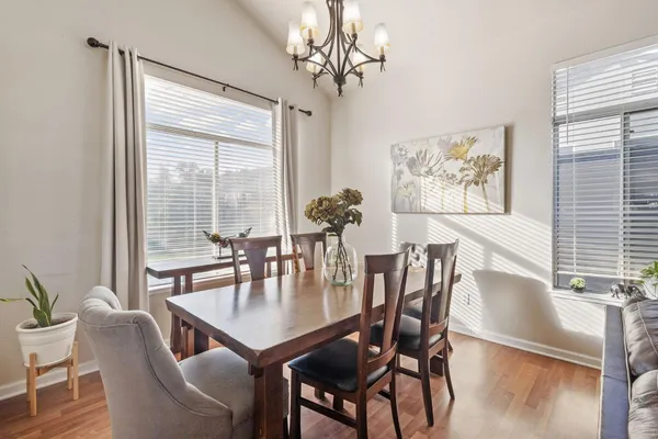 a view of a dining room with furniture window and outside view