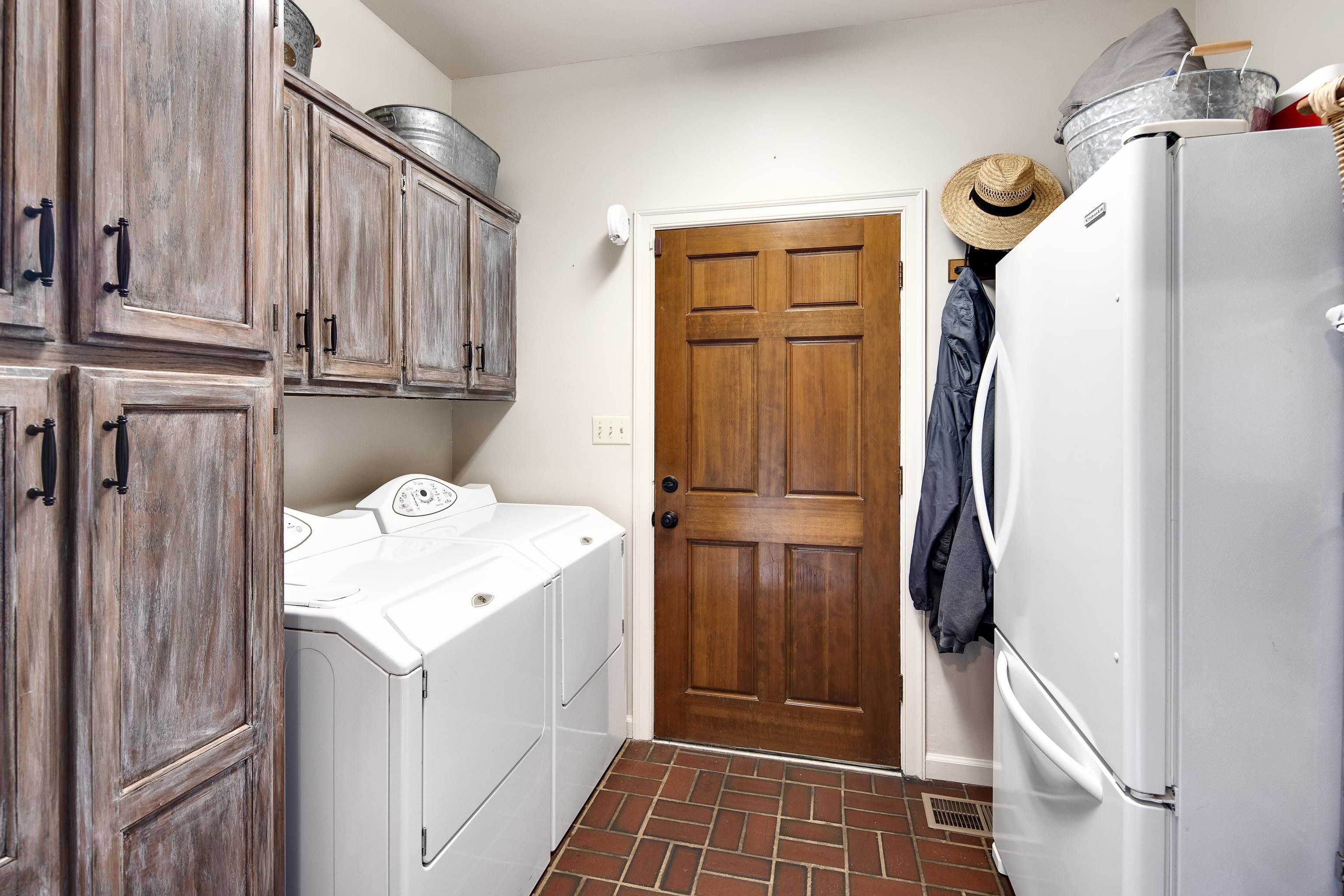1172 North Reid Hooker Road Eads, TN 38028 - Photo 23 of 33 Laundry room featuring cabinets and separate washer and dryer