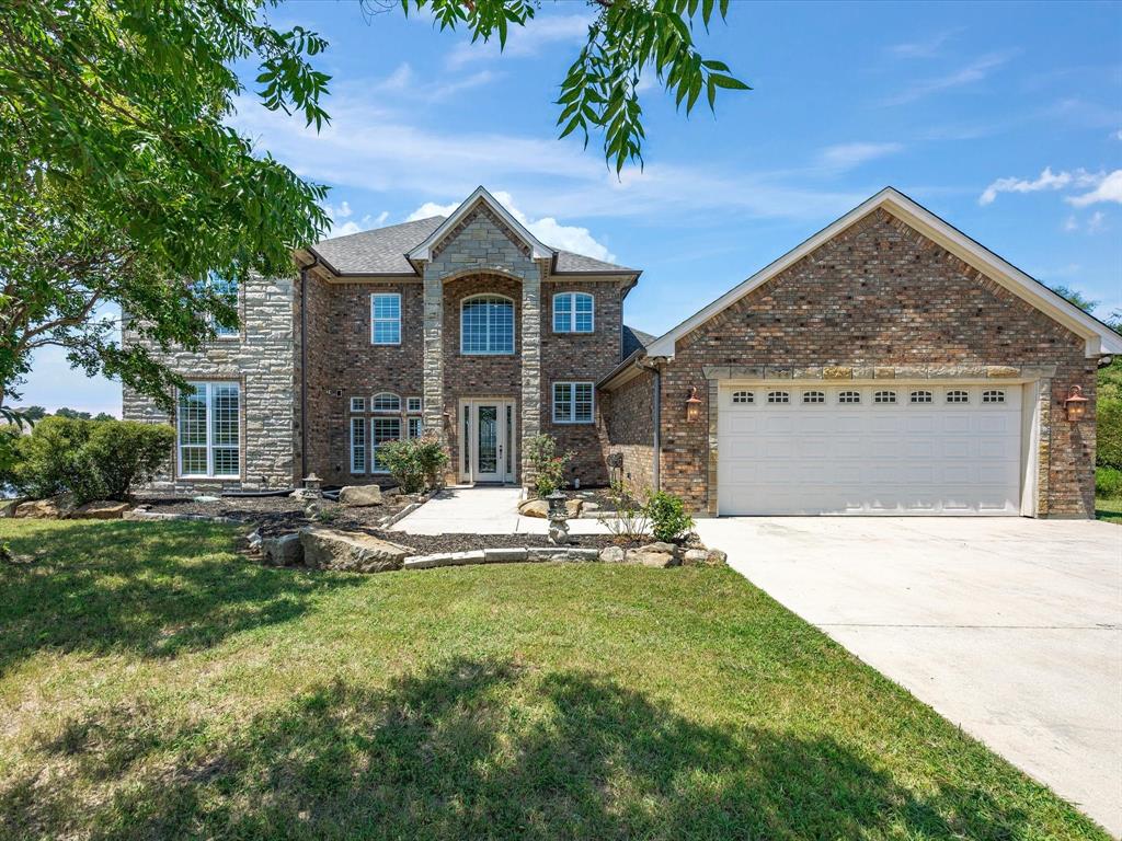 107 Marina Del Ray Bridgeport, TX 76426 - Photo 1 of 40 a front view of a house with garden