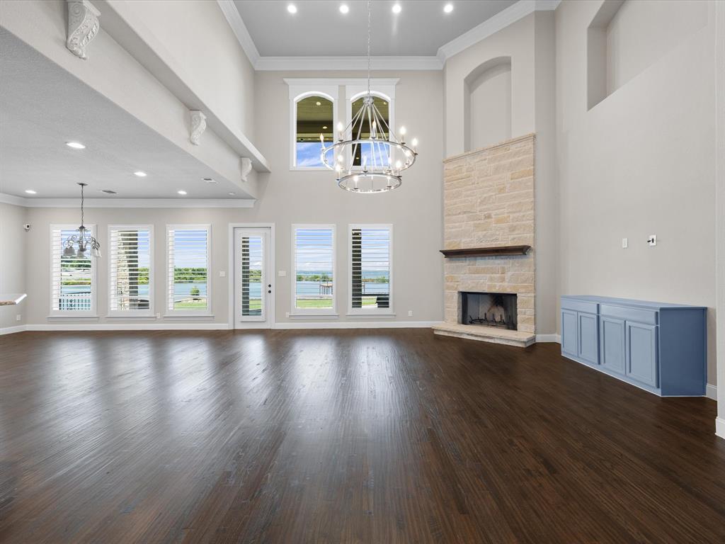 107 Marina Del Ray Bridgeport, TX 76426 - Photo 11 of 40 a view of an empty room with wooden floor and a window