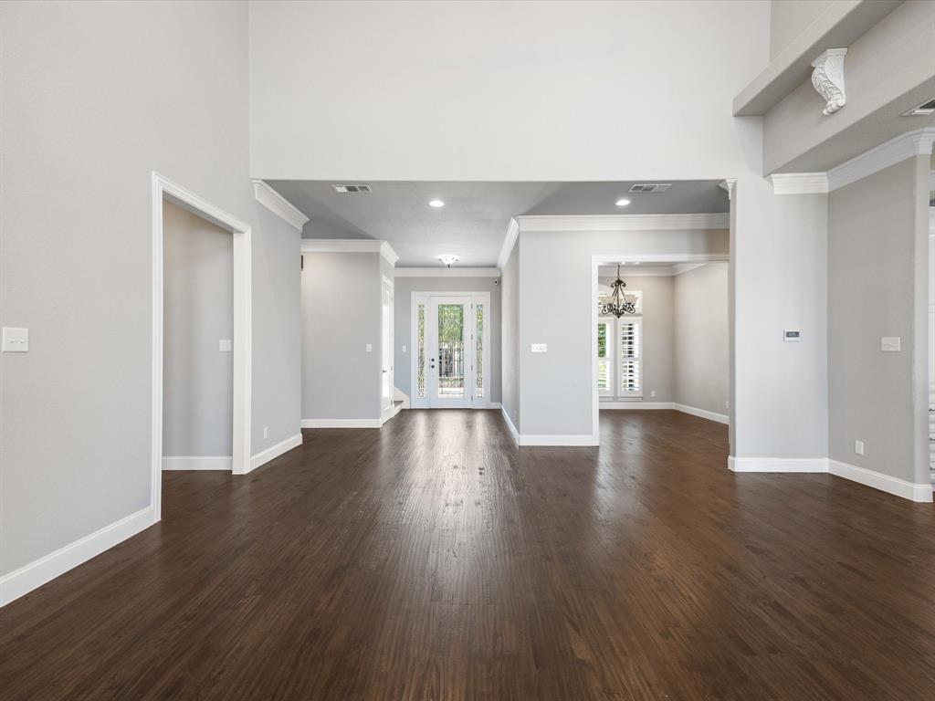 107 Marina Del Ray Bridgeport, TX 76426 - Photo 12 of 40 a view of an empty room with wooden floor and a window
