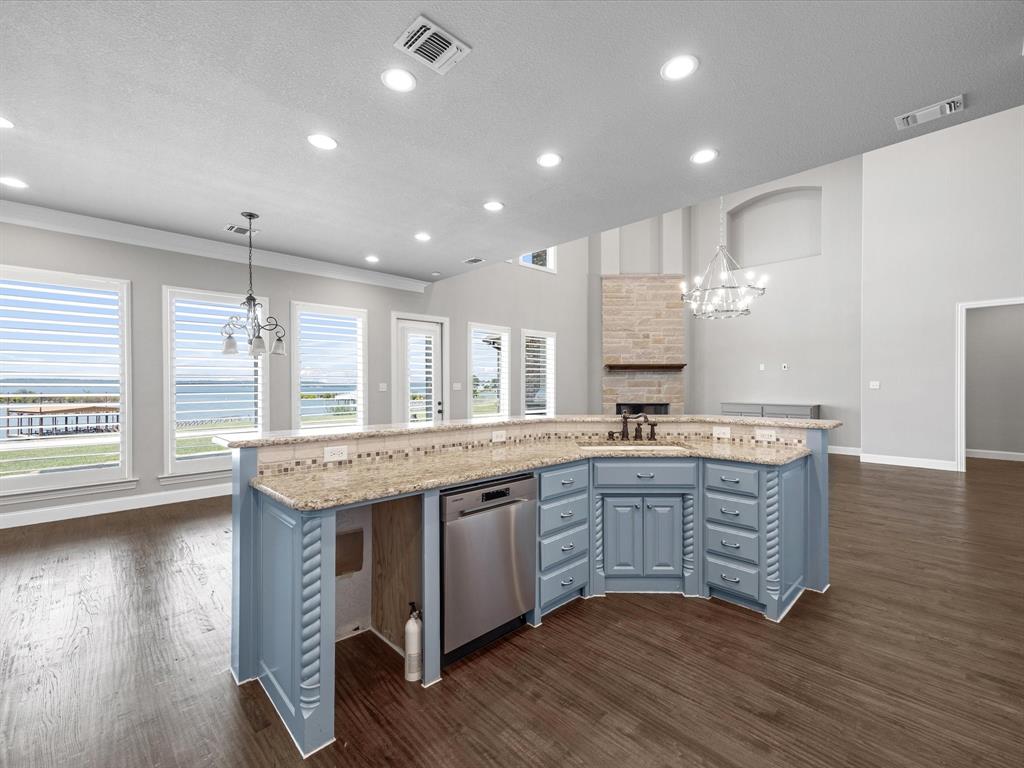 107 Marina Del Ray Bridgeport, TX 76426 - Photo 14 of 40 a large kitchen with granite countertop a stove and a sink