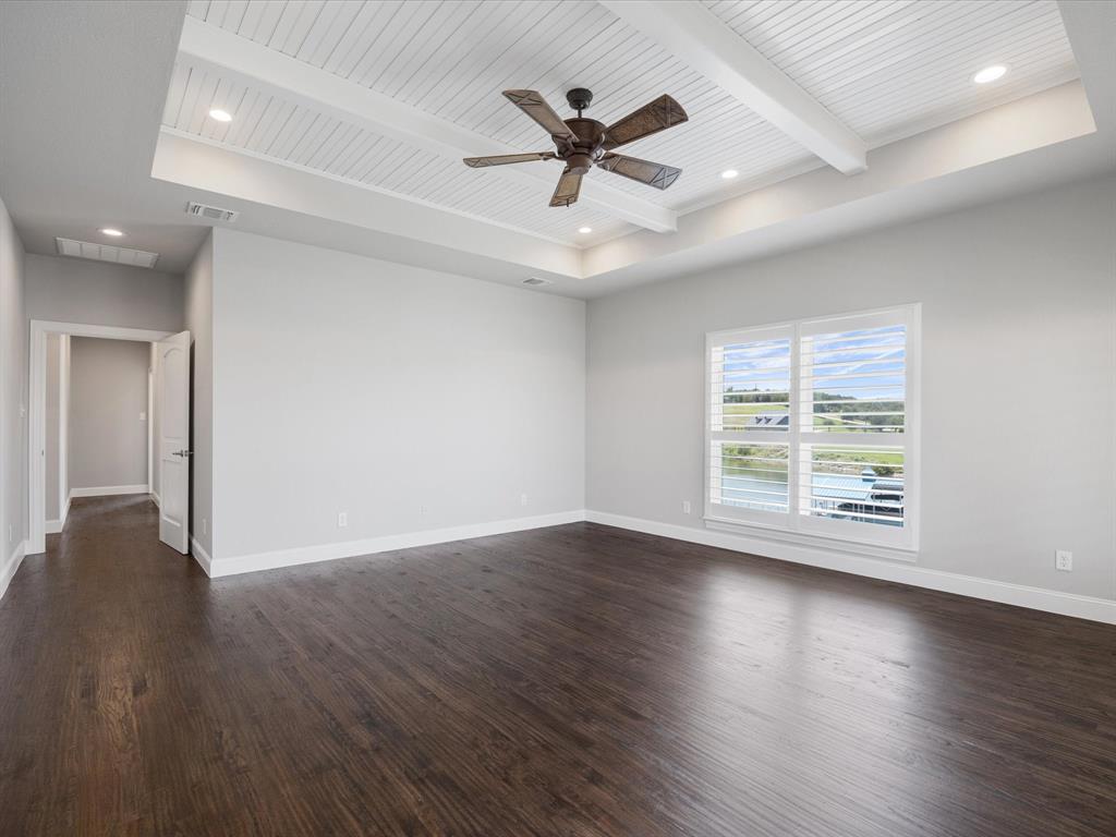 107 Marina Del Ray Bridgeport, TX 76426 - Photo 17 of 40 a view of empty room with wooden floor and ceiling fan