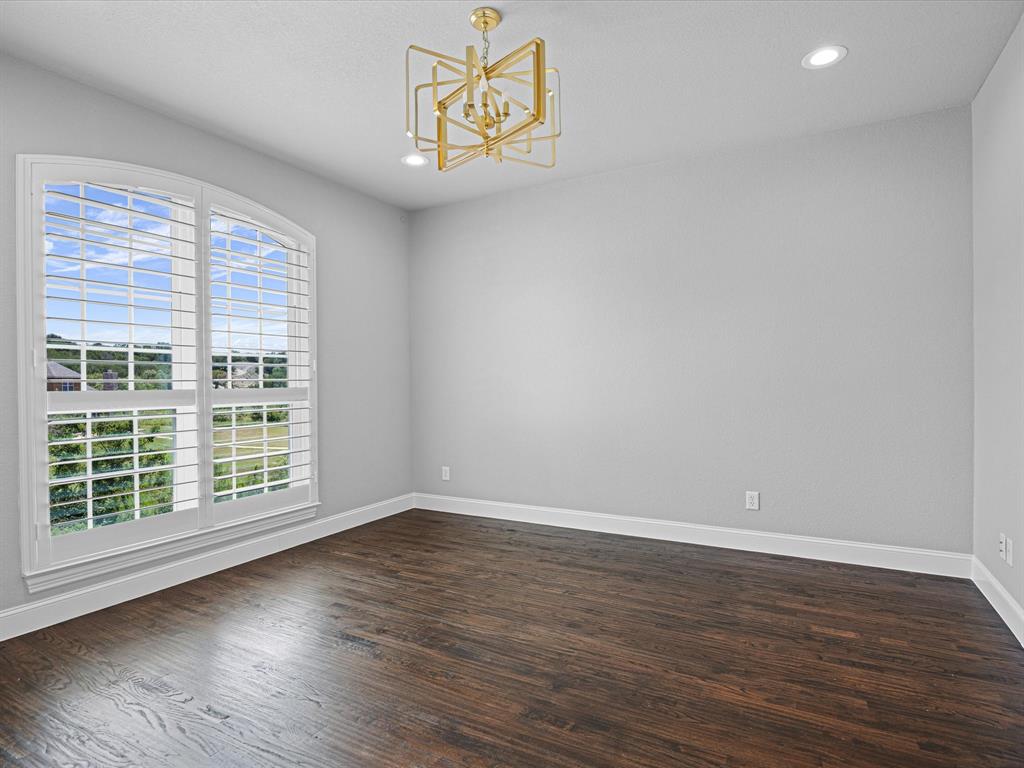 107 Marina Del Ray Bridgeport, TX 76426 - Photo 21 of 40 a view of an empty room with wooden floor and a window