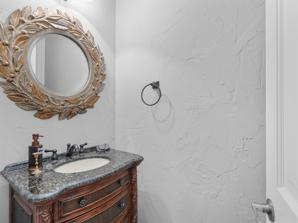 107 Marina Del Ray Bridgeport, TX 76426 - Photo 22 of 40 a bathroom with a granite countertop sink and a mirror