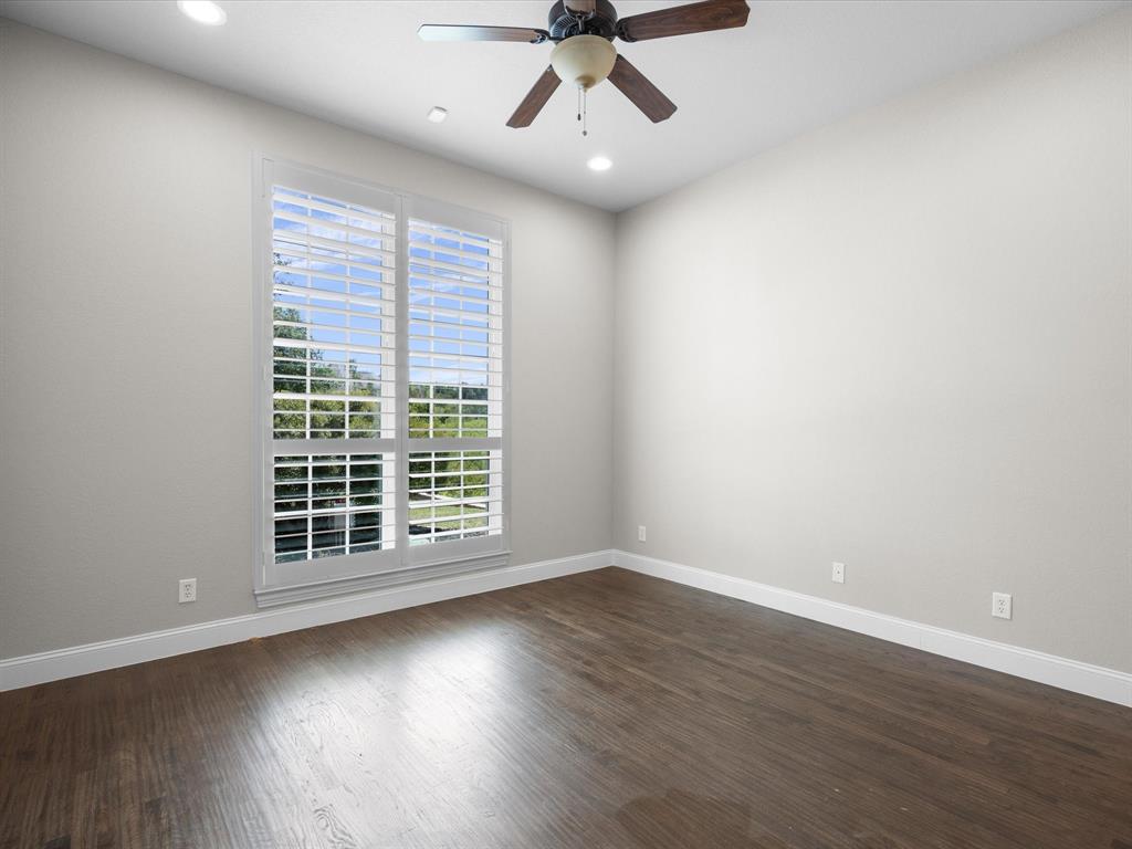 107 Marina Del Ray Bridgeport, TX 76426 - Photo 24 of 40 a view of an empty room with wooden floor and a window