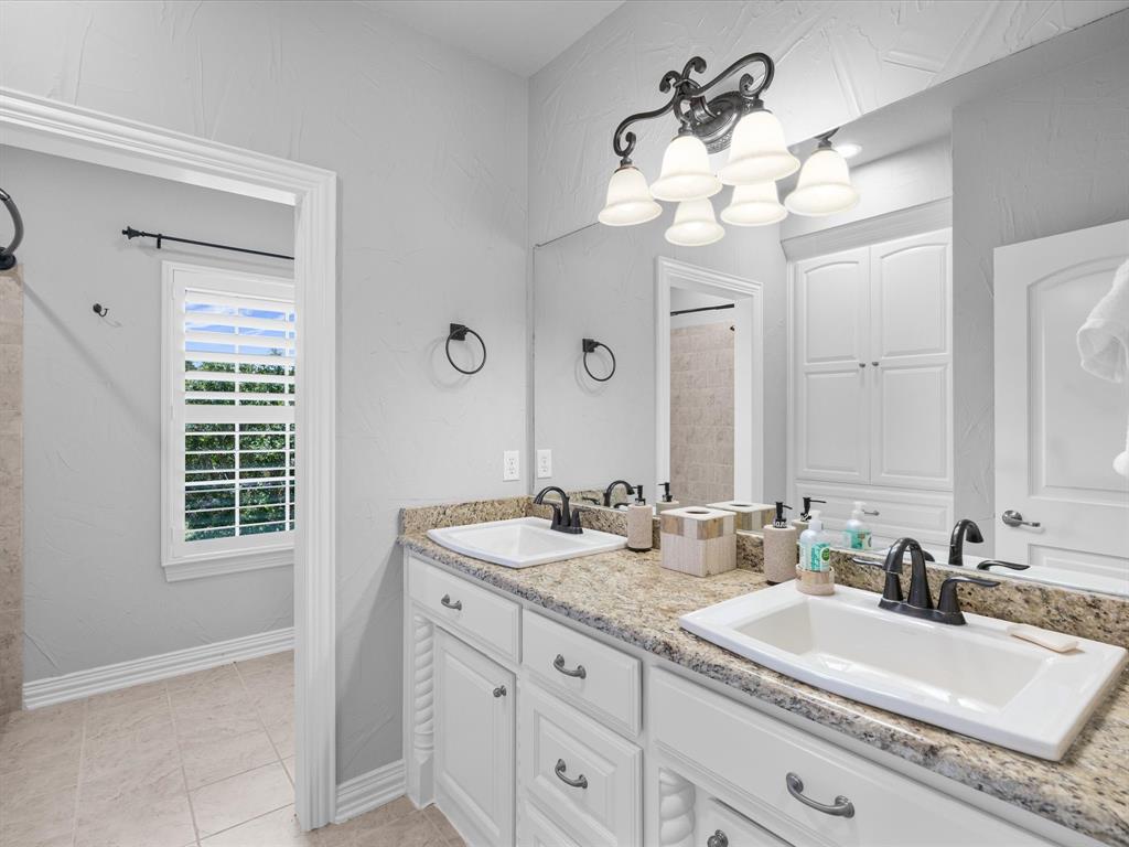 107 Marina Del Ray Bridgeport, TX 76426 - Photo 25 of 40 a bathroom with a sink double vanity and a mirror