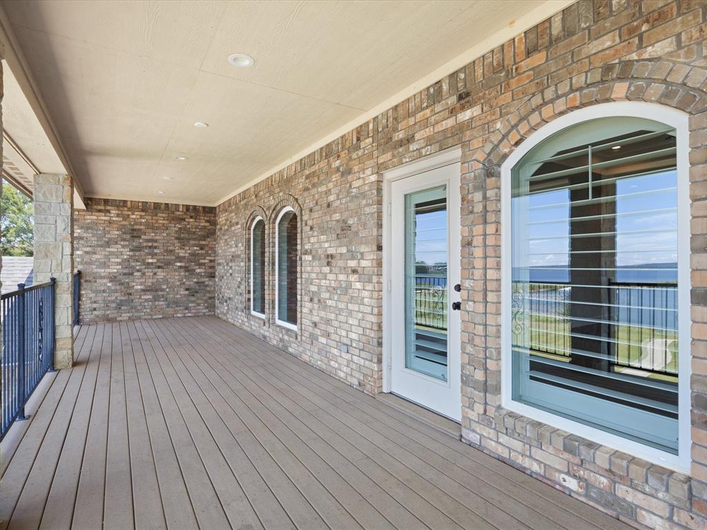 107 Marina Del Ray Bridgeport, TX 76426 - Photo 32 of 40 a view of outdoor space with wooden floor and entrance