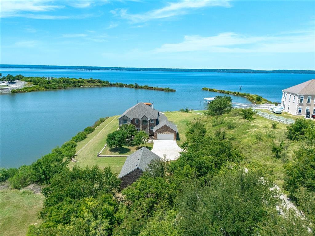 107 Marina Del Ray Bridgeport, TX 76426 - Photo 38 of 40 an aerial view of a house with a garden and lake view