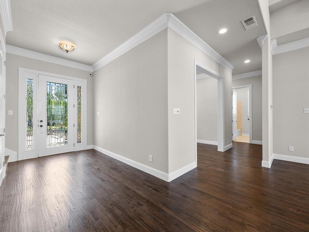 107 Marina Del Ray Bridgeport, TX 76426 - Photo 6 of 40 a view of an empty room with wooden floor and a window