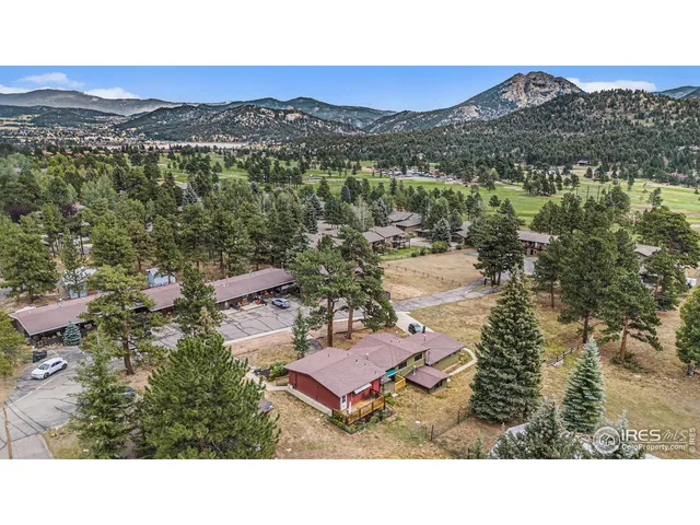 a view of a city with mountains in the background