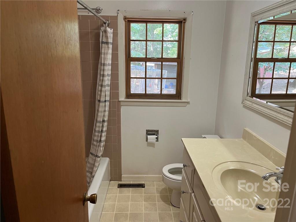 612 Mcdade Road Tryon, NC 28782 - Photo 12 of 27 a bathroom with a toilet and a sink