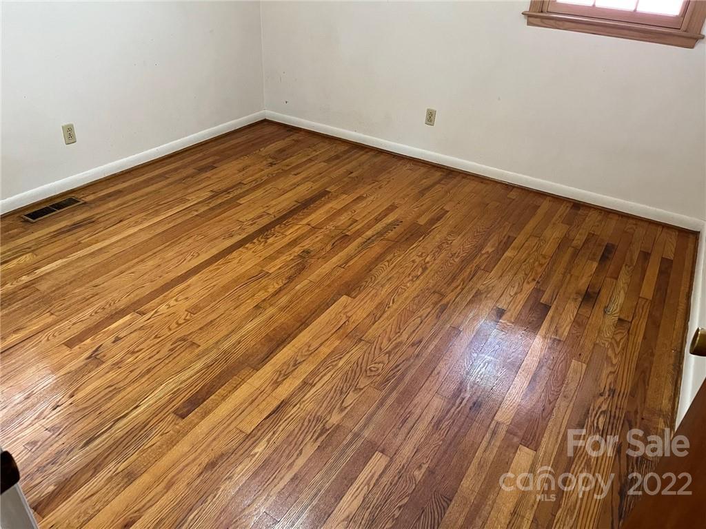 612 Mcdade Road Tryon, NC 28782 - Photo 14 of 27 a view of empty room with wooden floor